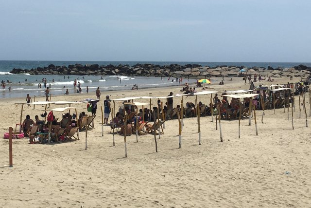 People enjoy a day on the beach in La Guaira, Venezuela May 17, 2018. Picture taken on May 17, 2018. REUTERS/Luc Cohen