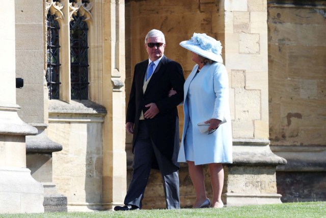 Sir Keith Mills and his wife Maureen Mills arrive at the wedding of Prince Harry to Ms Meghan Markle at St George's Chapel, Windsor Castle on May 19, 2018 in Windsor, England. Chris Jackson/Pool via REUTERS