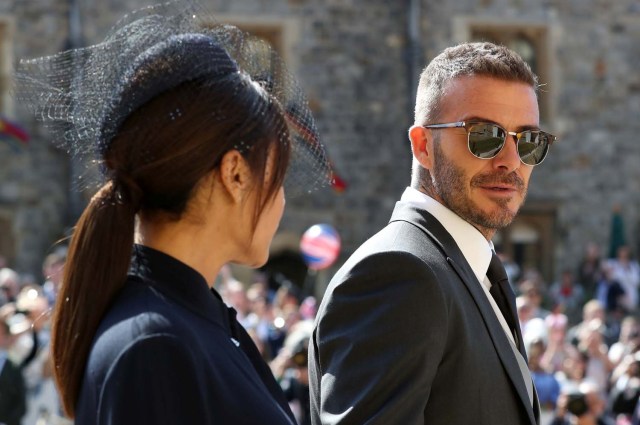 David Beckham and Victoria Beckham arrive at St George's Chapel at Windsor Castle for the wedding of Meghan Markle and Prince Harry in Windsor, Britain, May 19, 2018. Gareth Fuller/Pool via REUTERS