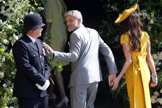 US actor George Clooney and his wife British lawyer Amal Clooney arrive for the wedding ceremony of Britain's Prince Harry, Duke of Sussex and US actress Meghan Markle at St George's Chapel, Windsor Castle, in Windsor, Britain, May 19, 2018. Odd ANDERSEN/Pool via REUTERS