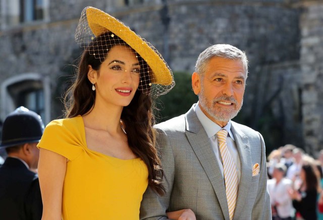 Amal Clooney and George Clooney arrive at St George's Chapel at Windsor Castle for the wedding of Meghan Markle and Prince Harry in Windsor, Britain, May 19, 2018. Gareth Fuller/Pool via REUTERS