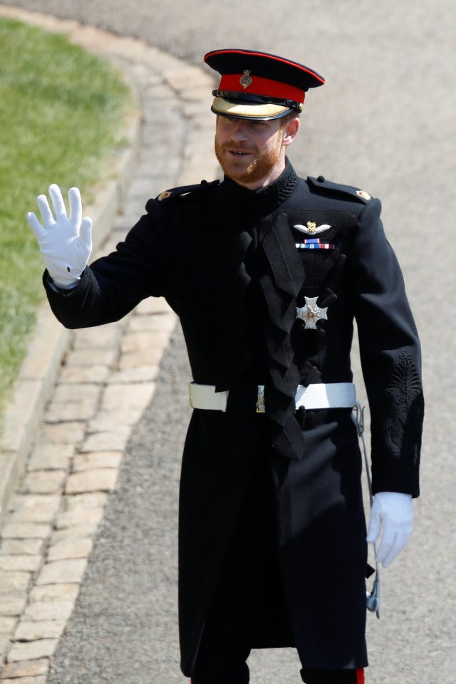 Britain's Prince Harry, Duke of Sussex, waves as he arrives at St George's Chapel, Windsor Castle, in Windsor, in Windsor, Britain, May 19, 2018. Odd ANDERSEN/Pool via REUTERS
