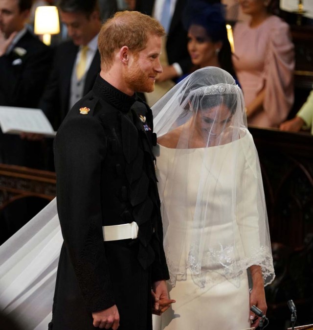 Prince Harry and Meghan Markle in St George's Chapel at Windsor Castle for their wedding in Windsor, Britain, May 19, 2018. Dominic Lipinski/Pool via REUTERS