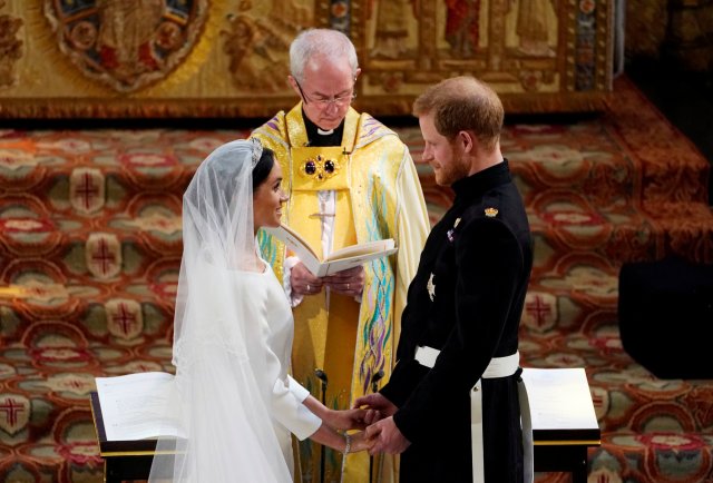 Prince Harry and Meghan Markle exchange vows in St George's Chapel at Windsor Castle during their wedding service, conducted by the Archbishop of Canterbury Justin Welby in Windsor, Britain, May 19, 2018. Owen Humphreys/Pool via REUTERS