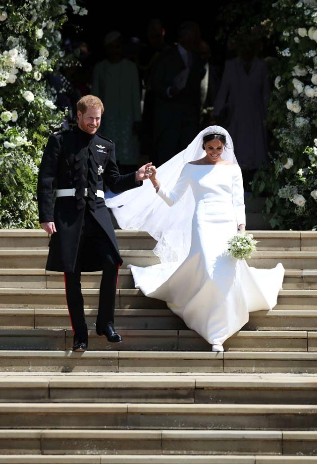 Prince Harry and Meghan Markle walk down the steps of St George's Chapel in Windsor Castle after their wedding. Saturday May 19, 2018. Jane Barlow/Pool via REUTERS
