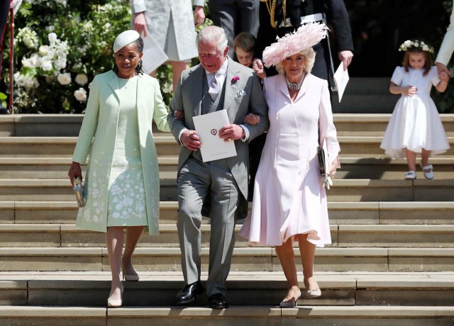 Doria Ragland, mother of the bride, the Prince of Wales and the Duchess of Cornwall walk down the steps of St George's Chapel in Windsor Castle after the wedding of Prince Harry and Meghan Markle in Windsor, Britain, May 19, 2018. Jane Barlow/Pool via REUTERS