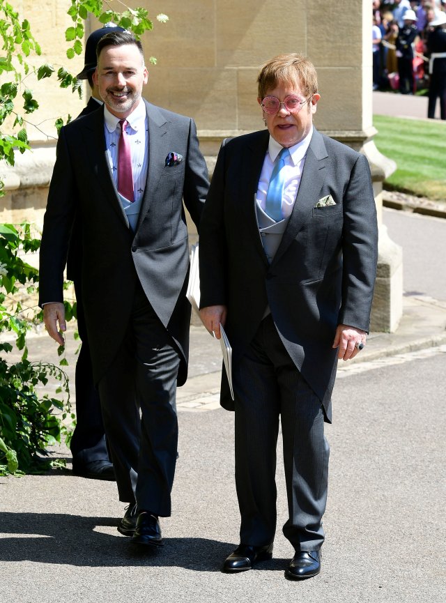 David Furnish and Elton John leave St George's Chapel at Windsor Castle after the wedding of Meghan Markle and Prince Harry. Saturday May 19, 2018. Ian West/Pool via REUTERS