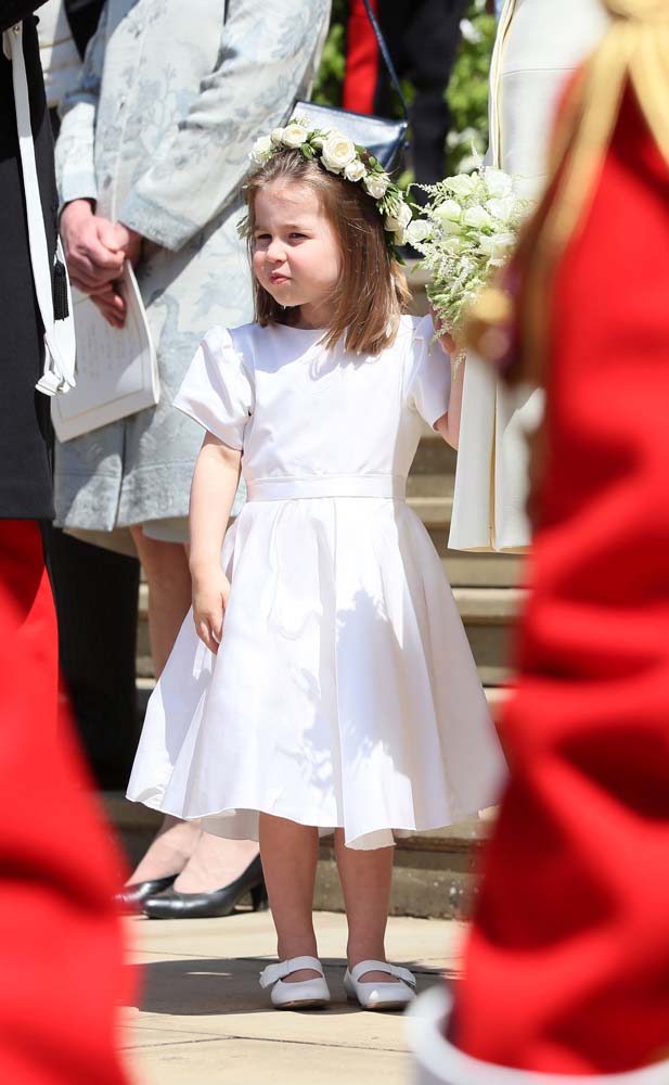 Princess Charlotte outside St George's Chapel in Windsor Castle after the wedding of Prince Harry and Meghan Markle in Windsor, Britain, May 19, 2018. Brian Lawless/Pool via REUTERS