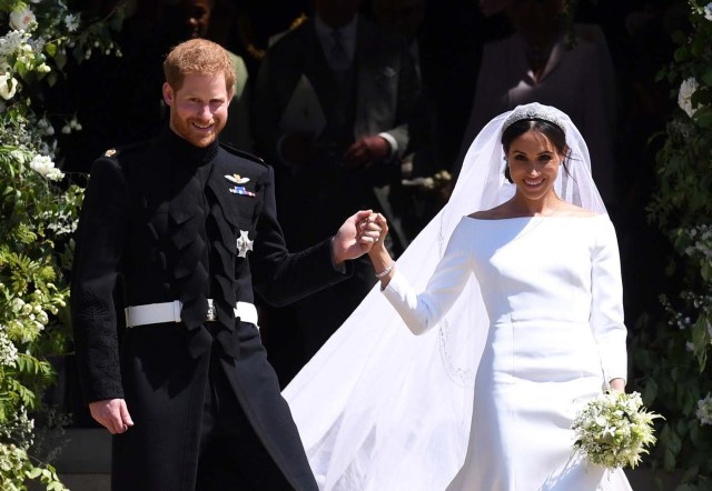 Britain's Prince Harry, Duke of Sussex and Meghan, Duchess of Sussex exit St George's Chapel in Windsor Castle after their royal wedding ceremony in Windsor, Britain, May 19, 2018. NEIL HALL/Pool via REUTERS