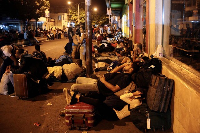People sleep on the street as they wait to stamp their passports close to the migration control office in San Antonio del Tachira, Venezuela May 16, 2018. Picture taken May 16, 2018. REUTERS/Carlos Eduardo Ramirez