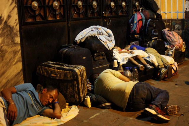 People sleep on the street as they wait to stamp their passports close to the migration control office in San Antonio del Tachira, Venezuela May 16, 2018. Picture taken May 16, 2018. REUTERS/Carlos Eduardo Ramirez