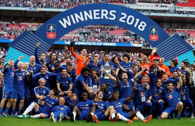 Soccer Football - FA Cup Final - Chelsea vs Manchester United - Wembley Stadium, London, Britain - May 19, 2018   Chelsea celebrate winning the final with the trophy   REUTERS/David Klein