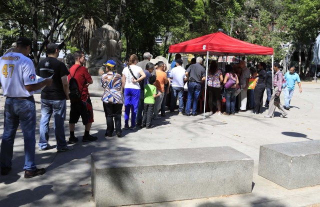 Venezuelan citizens wait to check in at a "Red Point," an area set up by President Nicolas Maduro's party, to verify that they cast their votes during the presidential election in Caracas, Venezuela, May 20, 2018.