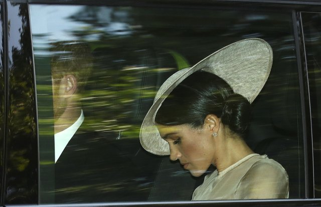 Los príncipes británicos Harry y Meghan, la duquesa de Sussex, llegan a una fiesta en el jardín en el Palacio de Buckingham, Londres, el 22 de mayo de 2018. REUTERS / Simon Dawson