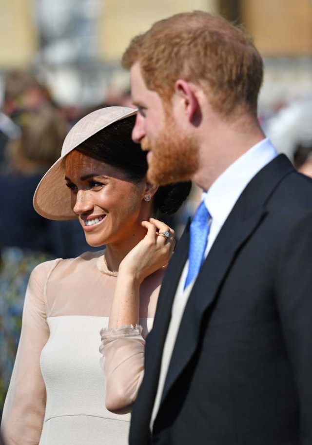 Britain'sÊPrince Harry and his wife Meghan, Duchess of Sussex attend a garden party at Buckingham Palace, their first royal engagement as a married couple, in London, May 22, 2018. Dominic Lipinski/Pool via Reuters