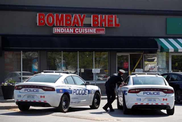 A police officer attends the crime scene at the Bombay Bhel restaurant after a bomb exploded in Mississauga, Ontario, Canada May 25, 2018. REUTERS/Mark Blinch
