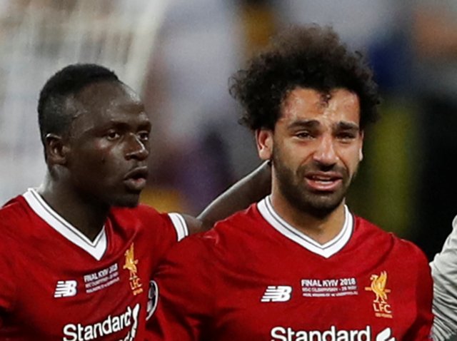 Soccer Football - Champions League Final - Real Madrid v Liverpool - NSC Olympic Stadium, Kiev, Ukraine - May 26, 2018   Liverpool's Sadio Mane consoles teammate Mohamed Salah as he is substituted off due to injury   REUTERS/Andrew Boyers