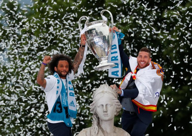 Soccer Football - Real Madrid celebrate winning the Champions League Final - Madrid, Spain - May 27, 2018   Real Madrid's Sergio Ramos and Marcelo celebrate during victory celebrations   REUTERS/Paul Hanna