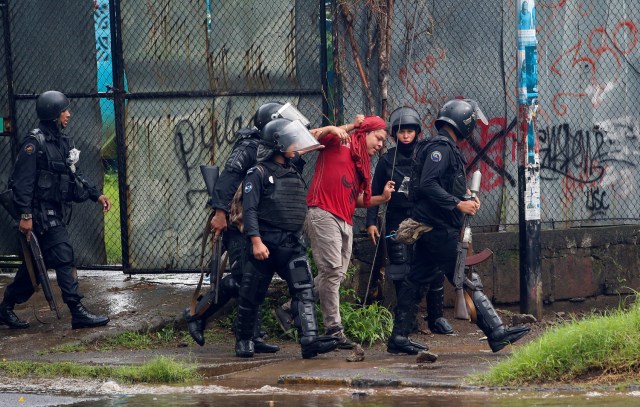 Riot police officers detain a demonstrator during a protest against Nicaragua's President Daniel Ortega's government in Managua, Nicaragua May 28, 2018. REUTERS/Oswaldo Rivas