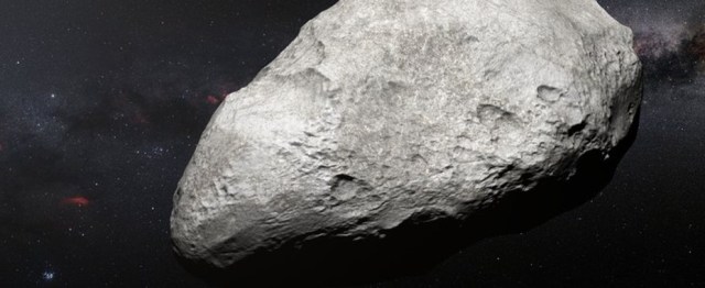 Esta ilustración muestra al asteroide 2004 EW95, el primer asteroide rico en carbono confirmado en el cinturón de Kuiper y una reliquia del sistema solar primordial.  / ESO/M. Kornmesser (@AlquimiaDigital)