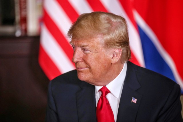 REFILE - ADDING RESTRICTIONS   U.S. President Donald Trump smiles next to North Korean leader Kim Jong Un (not pictured) at the Capella Hotel on Sentosa island in Singapore June 12, 2018. Kevin Lim/The Straits Times via REUTERS ATTENTION EDITORS - THIS PICTURE WAS PROVIDED BY A THIRD PARTY          FOR EDITORIAL USE ONLY. NO RESALES. NO ARCHIVES.
