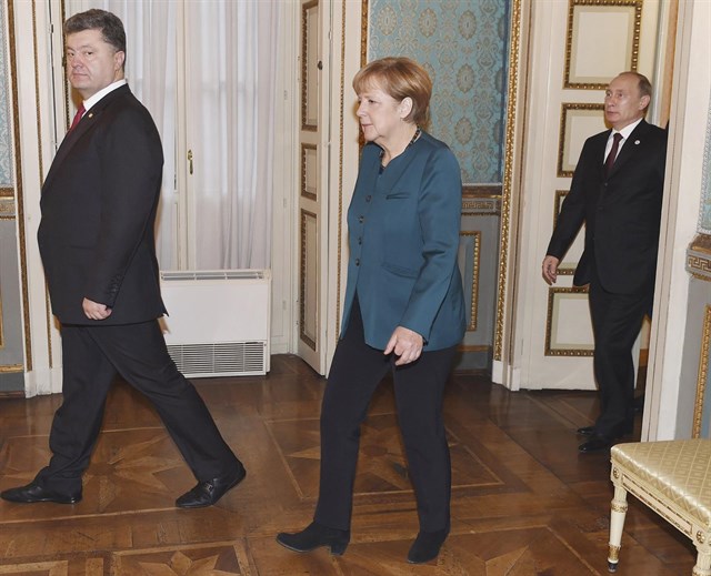 Poroshenko, Merkel y Putin, en una imagen de archivo