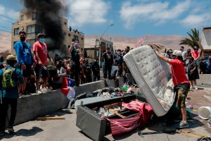 La policía chilena comienza investigación por quema de pertenencias de migrantes venezolanos
