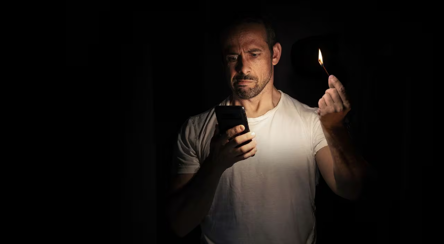 The trick to charging a cell phone battery when there is no light in the house